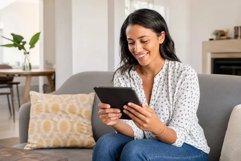 Woman reviewing cash offer on tablet